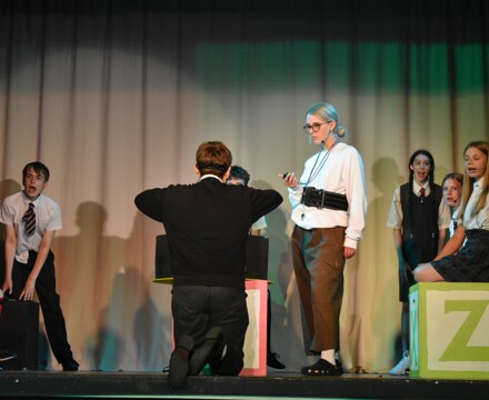 Ruby shepherd as miss trunchbull and miss honeys class performing bruce